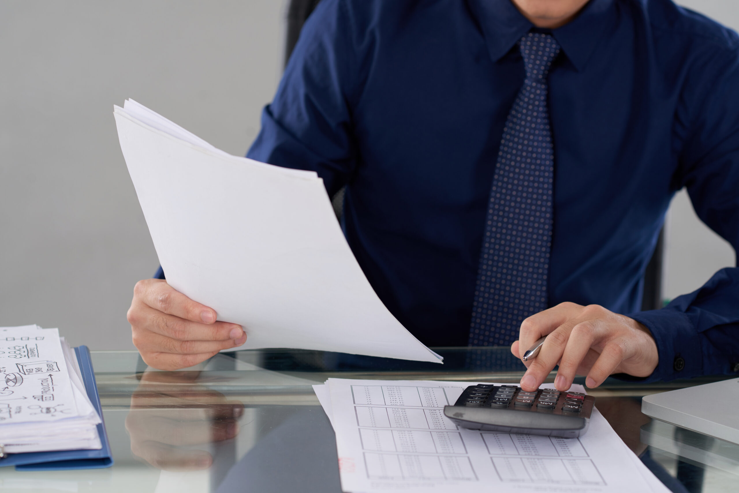 Cropped image of businessman checking financial report